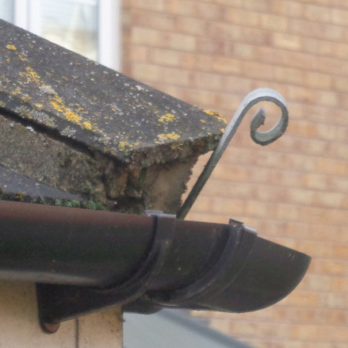 An image of a Galvanised Roof Hip Iron installed on the edge of the roof