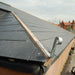 An image of a Galvanised Roof Hip Iron installed on the edge of the roof