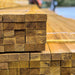 An image of a pile of banded Gold Treated Roof Battens.