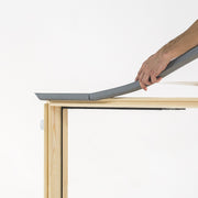 An image of a Dakea Insulation Foam Collar IFC being fitted to a wooden window frame.