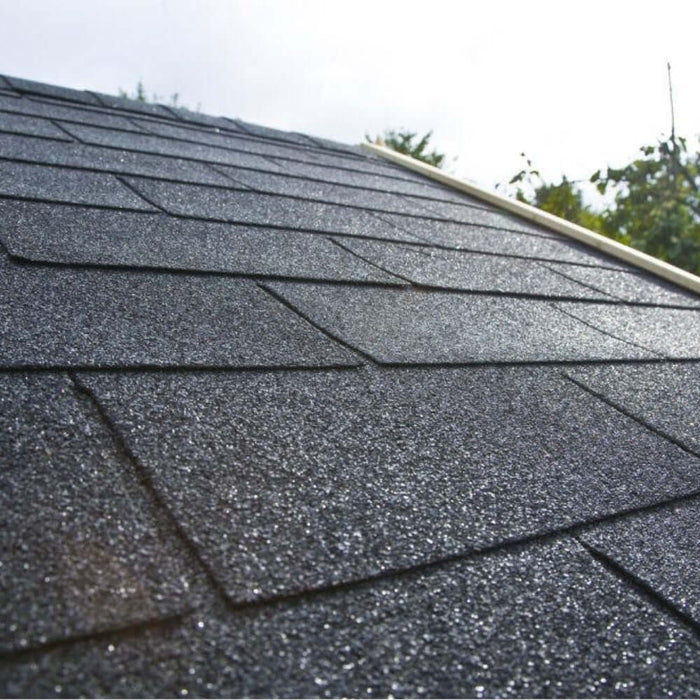 An image of a roof with IKO 4 Tab Armourglass Roofing Shingles in black