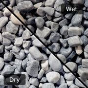 An image showing Ice Blue Pebble Stone Aggregate Gravel. The image is split horizontally to sow the difference between wet and dry.