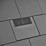 An image of a Timloc Inline Slate Vent fitted onto a roof to show the finished look and profile.