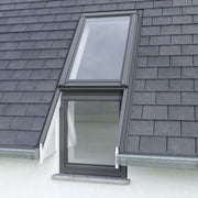 An image showing a Dakea Slate Flashing For Vertical Fixed Roof Windows - KSN. The image shows what it looks like from the outside of a roof when installed onto a roof window with an overhanging roof on either side of the window.