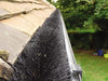 A fully installed gutter brush