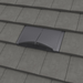 Image of a Manthorpe Interlocking Plain Tile Vent in the colour slate grey on a roof to show the profile in line with tiles.