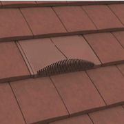 Image of a Manthorpe Interlocking Plain Tile Vent in the colour Antique Red on a roof to show the profile in line with tiles.