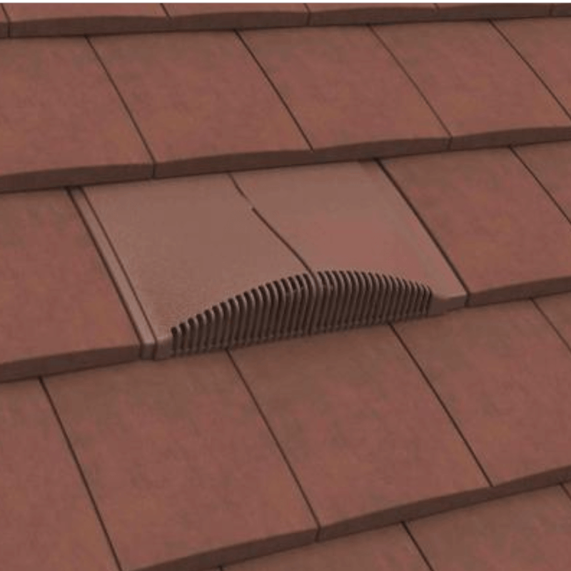 Image of a Manthorpe Interlocking Plain Tile Vent in the colour Antique Red on a roof to show the profile in line with tiles.