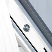 An image showing a close up of a Dakea Secure White Centre Pivot Roof Window in white KAQ B1010Q and the locking mechanism 