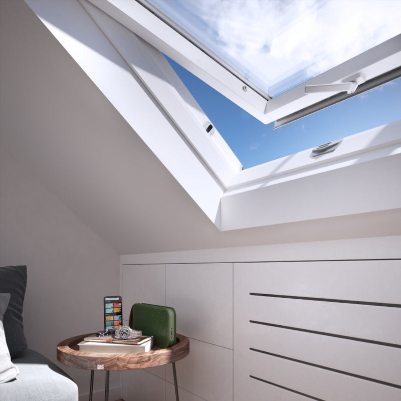 An image showing a close up of a Dakea Secure White Centre Pivot Roof Window in white KAQ B1010Q and the locking mechanism