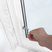 An image showing a close up of a Dakea Secure White Centre Pivot Roof Window in white KAQ B1010Q and the locking mechanism 
