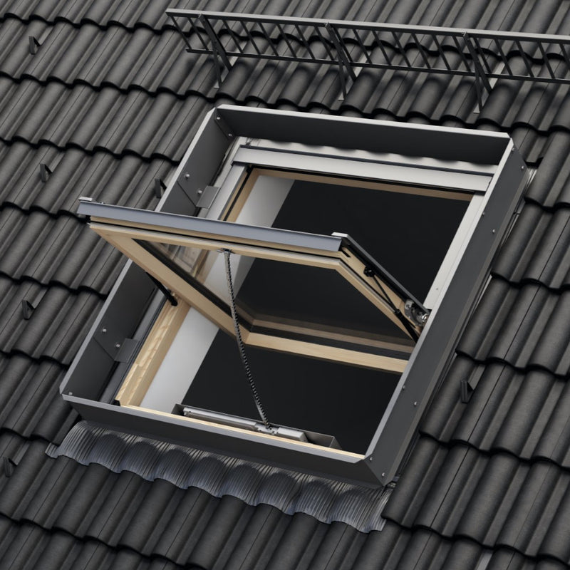 An image showing a Dakea SMOKE VENT ENERGY Roof Window - KAS B1600 S6A with a wood finish and  wind deflector KWU and what it looks like from the outside.