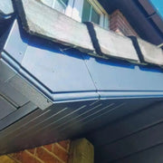 An image of a Soffit Board: Black Ash used under the facia.