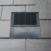 An image of a Klober Dark Slate Uni Line Slate Vent KG9630 0403  on a roof to show what it looks like with the slate.