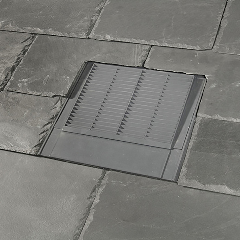 An image of a Klober Slate Grey Mini Uni Line Slate Vent KG9631 0429 on a roof to show what it looks like with the slate.