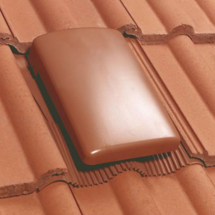 An image of a Terracotta roof with Klober Universal Roof Tile Vent and Cap fitted to show what it would look like.