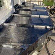 An image showing a lead roof fitted around Wooden Roll Mops that are 50mm wide for a decorative finish