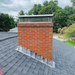 An image of Code 4 Lead being used as Chimney Flashing on a pitched roof.