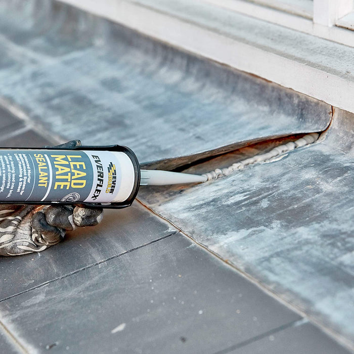 An image of Bond It Flash-Mate Lead Sealant in a 310ml tube being applied to lead on a roof