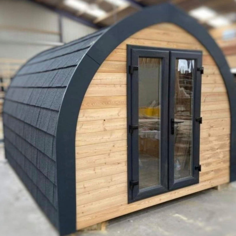 A wooden Pod covered with Lightweight Metal Roof Shingles in Titanium Grey
