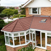 A solarframe conservatory roof howlett cover in Lightweight Metal Roof Shingle
