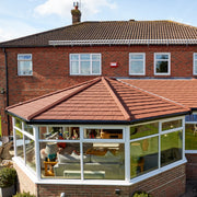 An image of a conservatory but the Britmet 5-Way Hip Top Cap fitted to the ridge