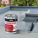 An image of a tin of Everbuild Aquaseal Liquid Roof being applied to a roof with a roller