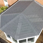 A conservatory roof in Lightweight Metal Roof Shingles with a 5 way ridge top cap.