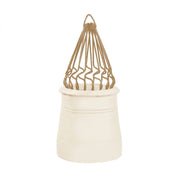 An image of a sprung bird guard in Buff by MAD Cowls fitted into a chiney pot to show how they look when fitted.