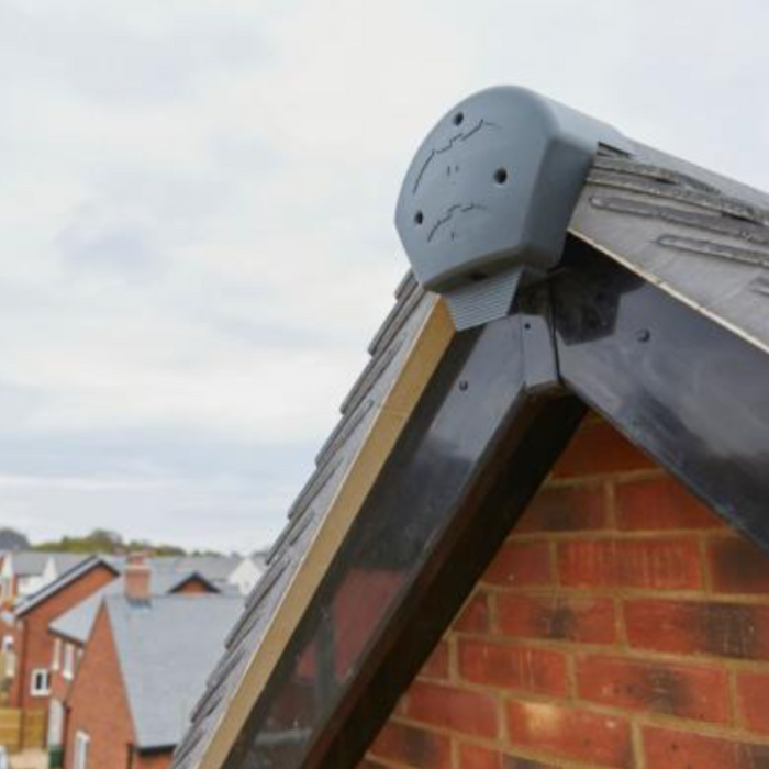 Image of a grey bat box ridge end cap on the side of a house to show what it would look like