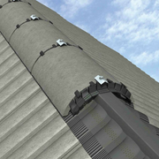 An image of half round ridge tiles that have Black Manthorpe Dry Ridge Union Brackets used to hold them in place..