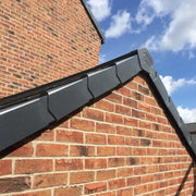 An image of Manthorpe GDV Angles End Cap Grey on the side of a roof to show what it looks like.