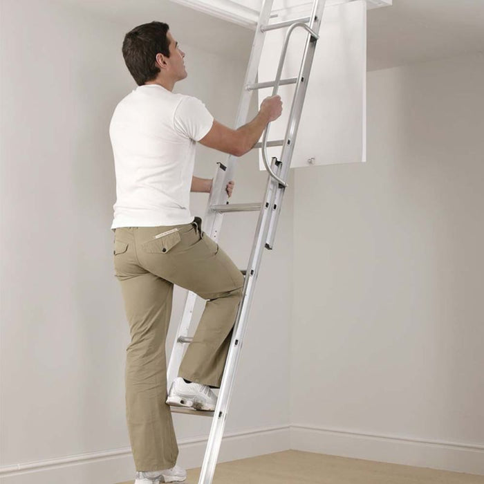 An image of a Manthorpe GLL256 2 Section Loft Ladder and someone climbing up it to show the size.