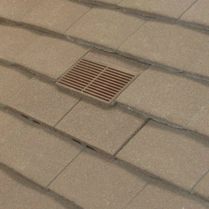 An image of Manthorpe Granulated Plain Tile Vent in Antique Brown on a roof to show the finish.