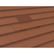 An image of Manthorpe Plain Tile Vent in Terracotta on a roof to show the finish.