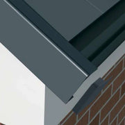 An image of a Manthorpe Linear Dry Verge Eaves End Closure Cap in Grey and where it is fitted.