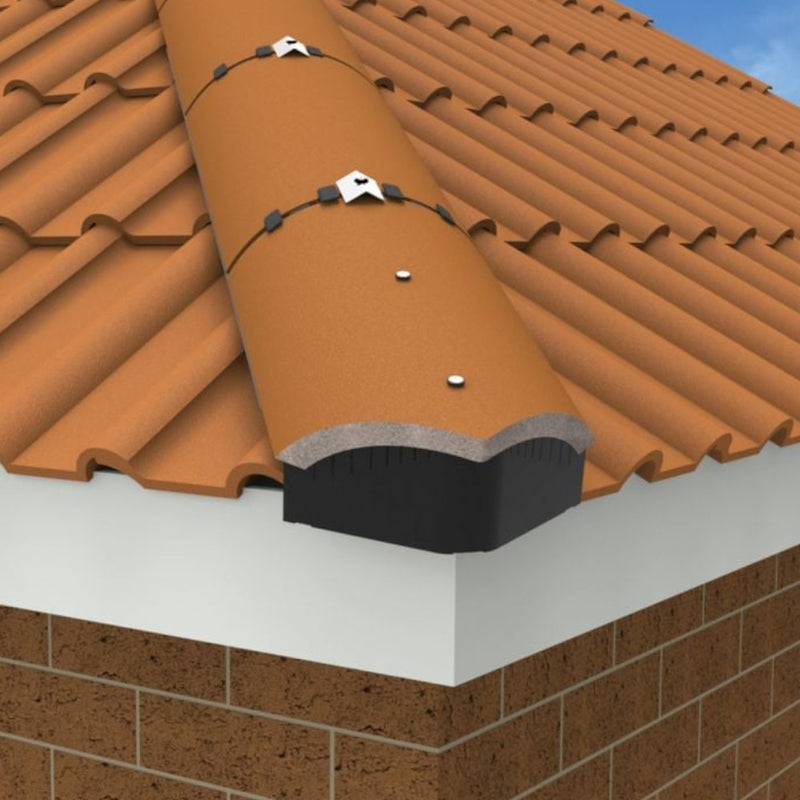 An image showing a Manthorpe Universal Hip End Closer on the edge of a half hound ridge tile to show where they are fitted.