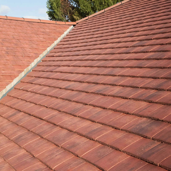 An image of Marley Ashmore Interlocking Tiles laid and installed onto a pitched roof to show how they look.