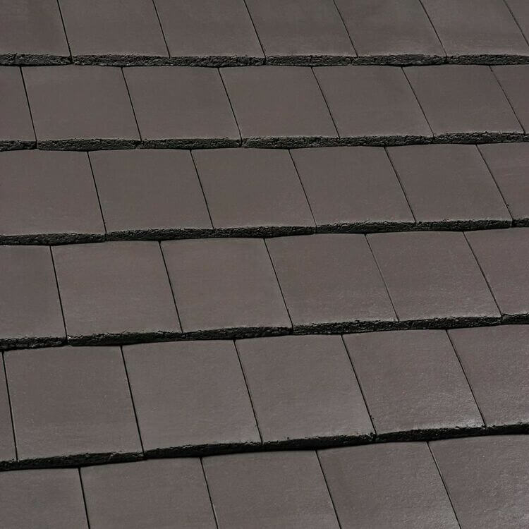 An image of Marley Ashmore Interlocking Tiles in Smooth Brown.
