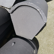 An image showing a Marley Concrete Segmental Stop End Ridge Tile.