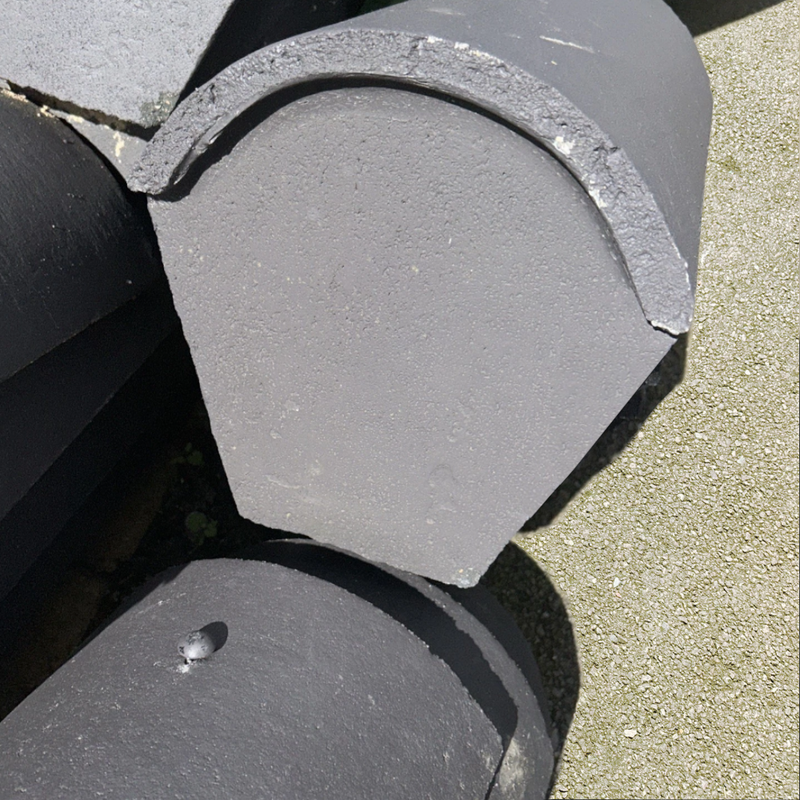 An image showing a Marley Concrete Segmental Stop End Ridge Tile.