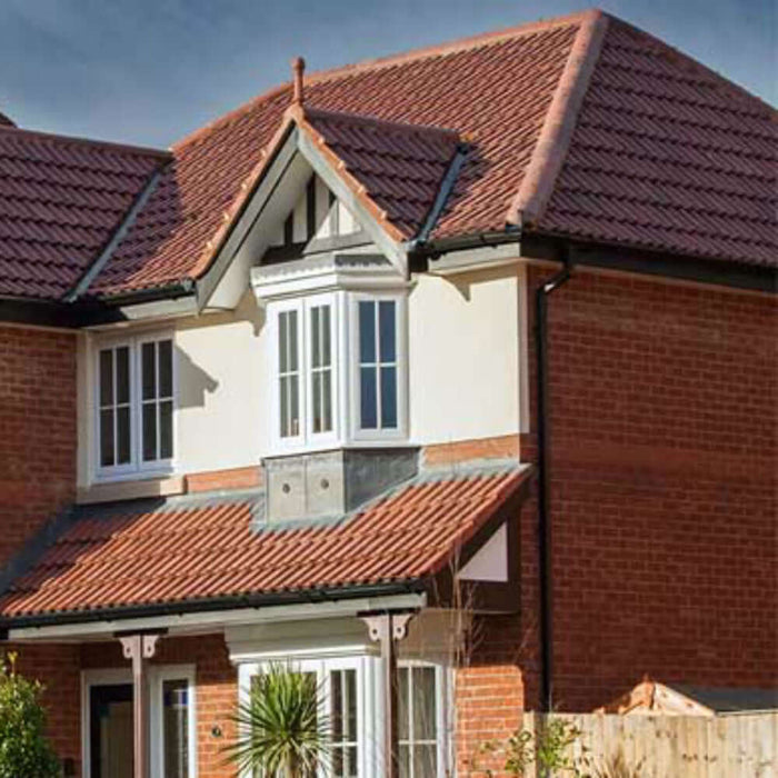 An image of a roof fitted with Marley Double Roman Interlocking Tiles to show what it looks like.