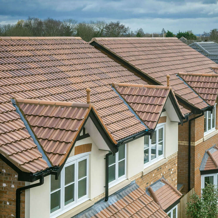 An image of a roof fitted with Marley Double Roman Interlocking Tiles to show what it looks like.