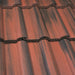 An image of Marley Double Roman Interlocking Tiles in Old English Dark Red