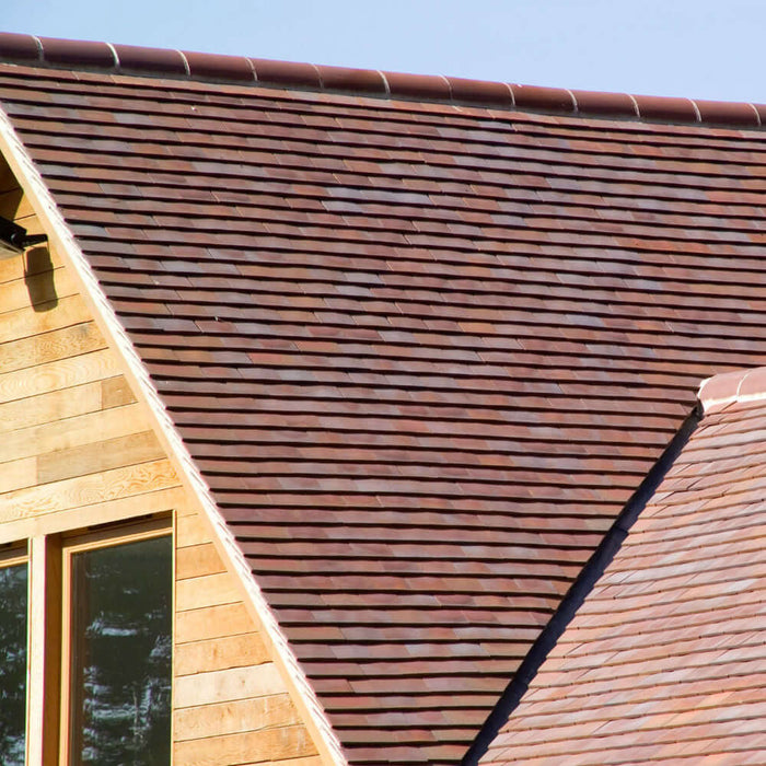 An image of a roof fitted with Marley Hawkins Plain Clay Tiles to show what they looks like.