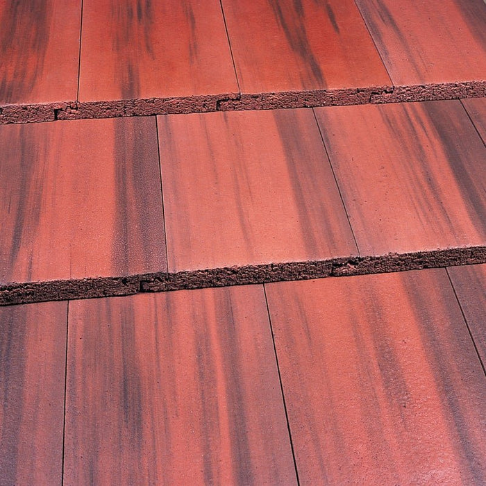 An image of a Marley Modern Interlocking Roof Tile Old English Dark Red.