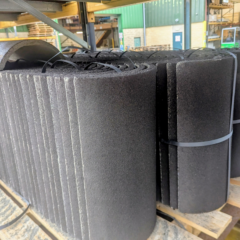 An image of Marley Moderns Segmental Ridge Tiles in Anthracite stacked on a Pallet