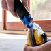 An image of a Chalk Line Reel being re-filled to show what the product is for.