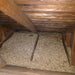 Image shows a loft / attic / Roof Space with  Micafil Vermiculite Loose Fill used as insulation.