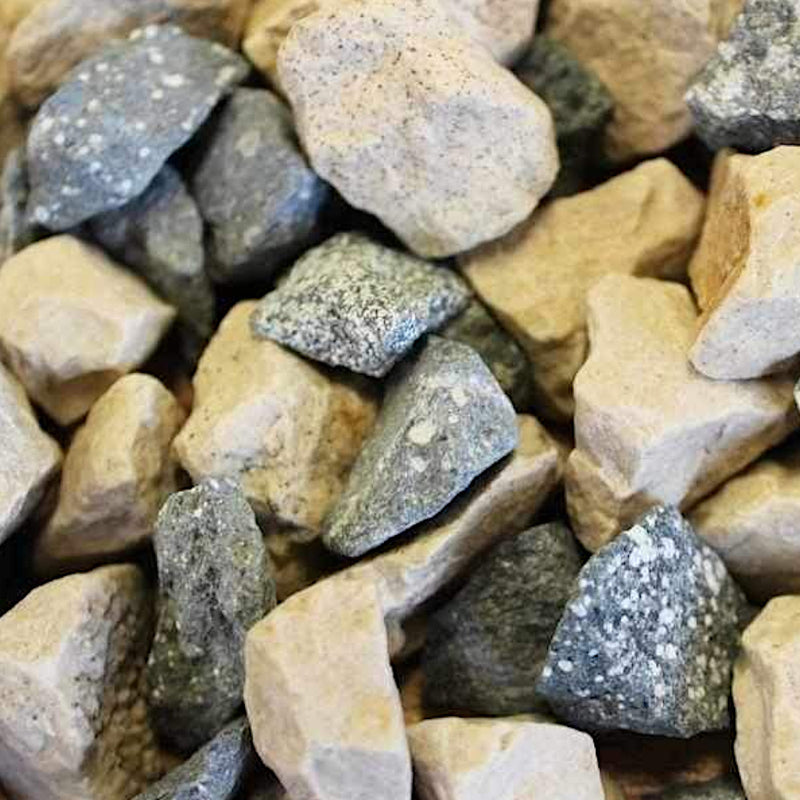 An image of aggregates in the colour of Mint Cream which are 20mm in size. They are speckled green granite chips mixed with a creamy Cotswold stone
